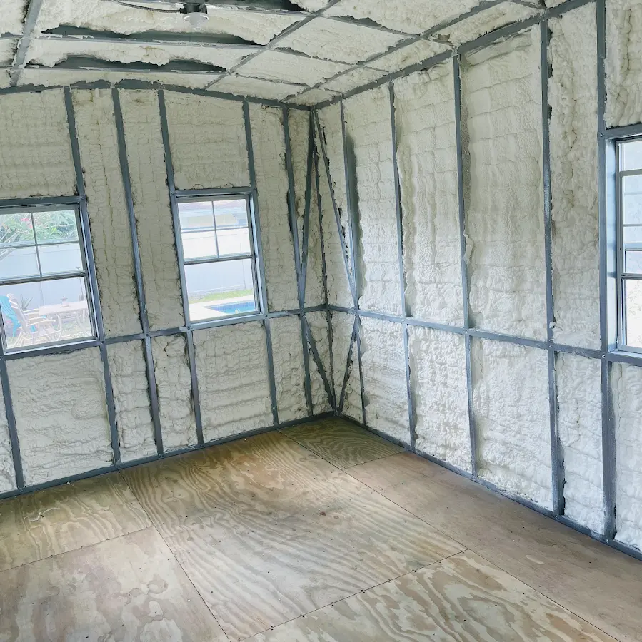 Closed-cell spray foam insulation applied to wall cavities in a residential project in Royal Palm Beach